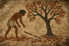 The hunter finds the spear laying below a tree, but the spear is broken